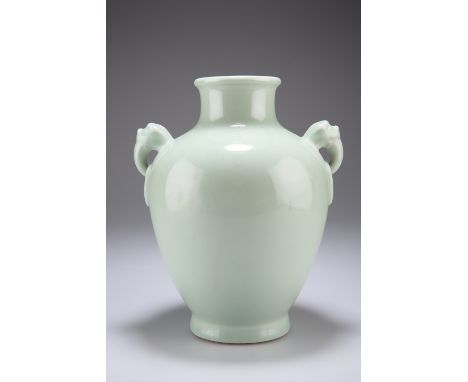 A CHINESE CELADON VASE, of shouldered ovoid form with mask-moulded 'ring' handles, bears underglaze blue seal mark. 24cm high