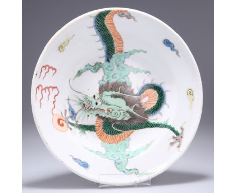 A CHINESE FAMILLE VERTE PORCELAIN DISH, circular, enamel painted in the characteristic palette with a four clawed dragon, the