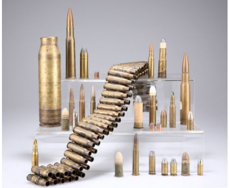 A BOX CONTAINING A QUANTITY OF USED SMALL ARMS ORDNANCE, including a .303 ammunition belt and a selection of loose cases. (qu