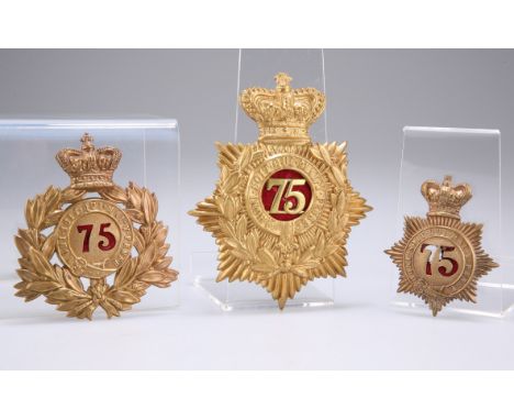 A 1861-68 SHAKO PLATE, A 1869-78 SHAKO PLATE AND A FIRST PATTERN 1878-81 HELMET PLATE, all to the 75th Regiment of Foot, all 