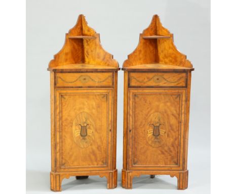 A PAIR OF EDWARDIAN INLAID SATINWOOD CORNER CABINETS, each with shelved superstructure above a rosewood banded top centred by