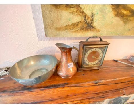 Eastern copper jug and a mantle clock