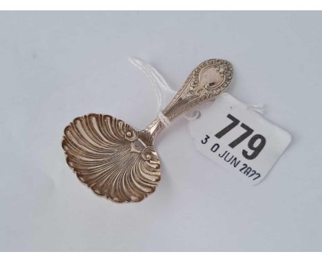 A Victorian caddy spoon with shell bowl and cast stem, Sheffield 1868 by Martin Hall &amp; Co