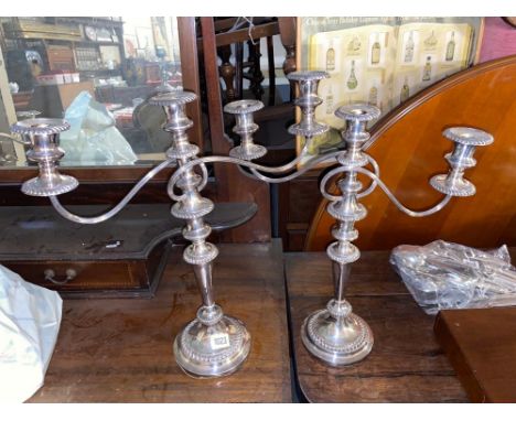Pair of three light candleabra with gadroon borders. 20” high