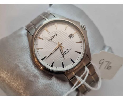 A LORUS men's titanium wrist watch with seconds sweep and calender dial with stainless steel strap in original box (as new)