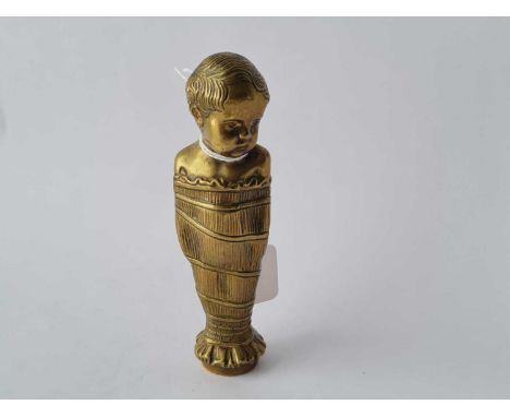 A metal pipe tamper of a child in swaddling clothing