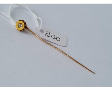 A gold and diamond topped stick pin – 1.4 gms