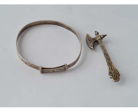 A silver axe brooch and silver bangle