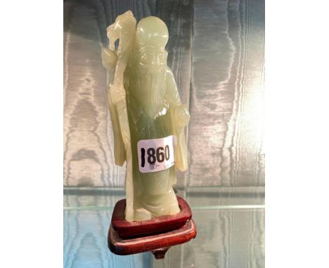 Carved Jade type figure of a sage on wood base.6" high