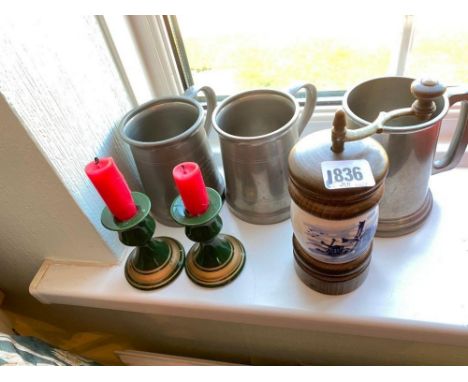 Three pewter tankards. Pepper grinder with Delft type body
