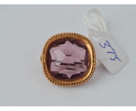 A Vintage gilt purple stone brooch