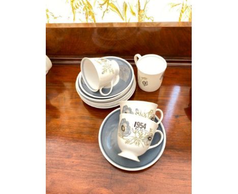 Three Susie Cooper cups, saucers and plates