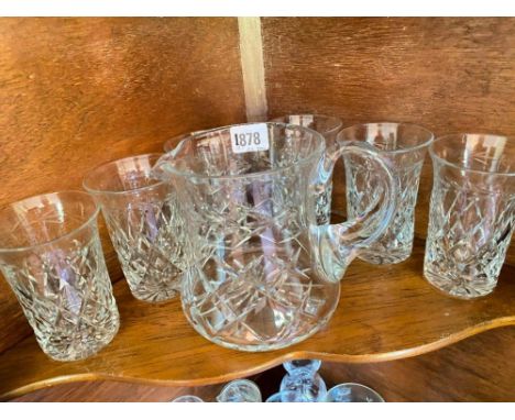 Cut glass water jug and six tumblers and a shelf of glass ware