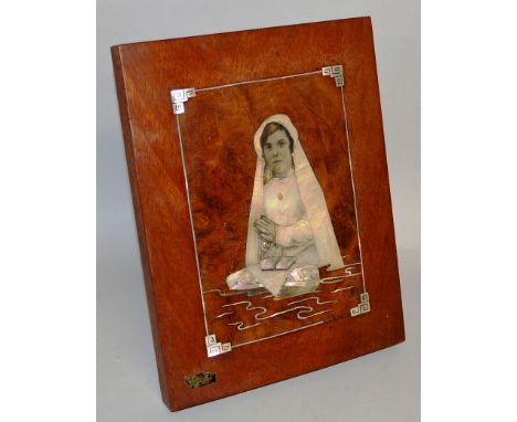 A VIETNAMESE MOTHER OF PEARL PORTRAIT of a young girl praying, with label OO.NHU.LIEN SAIGON. 12ins x 9.5ins.