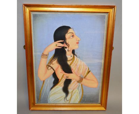 INDIAN SCHOOLHalf length watercolour portrait of a young lady holding her hair. 20ins x 15ins.