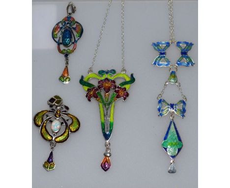 FOUR ART NOUVEAU DESIGN SILVER AND ENAMEL PENDANTS.