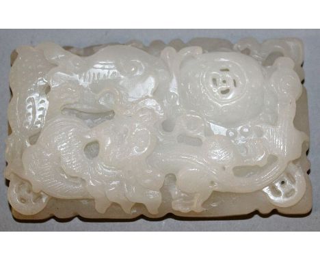 A CHINESE WHITE JADE-LIKE TABLET, 3.1in long.