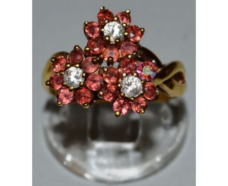A TRIPLE RUBY & DIAMOND FLOWER BROOCH.
