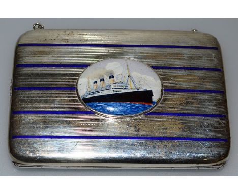 A SILVER AND BLUE ENAMEL CIGARETTE CARD CASE, Birmingham 1911, inset with an oval of a steam ship.