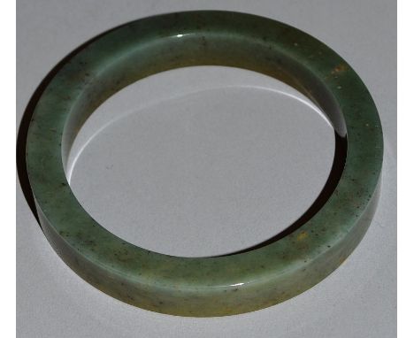 A JADE BANGLE.