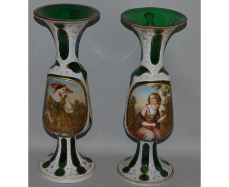 A GOOD PAIR OF BOHEMIAN GREEN AND WHITE OVERLAY VASES with gilt decoration painted with portrait panels of pretty girls. 12in
