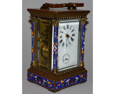 A CLOISONNE AND BRASS REPEATER CARRIAGE CLOCK. 7ins high.