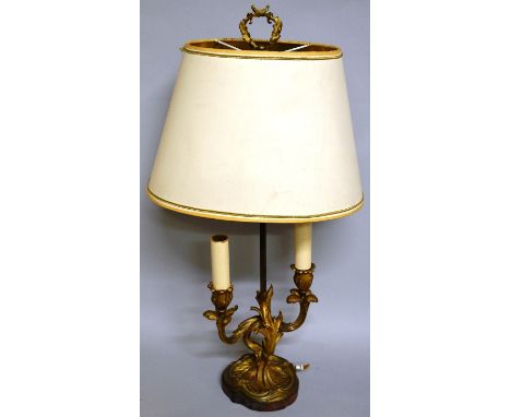 A 19th CENTURY FRENCH ORMOLU TWO BRANCH LAMP with acanthus mounts and oval shade on a wooden base. 26ins high.