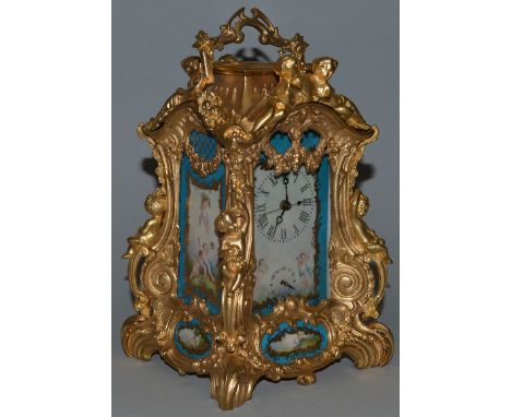 A GOOD SEVRES AND ORMOLU ALARM CLOCK of unusual shape, the case with scrolls and cupids with painted Sevres panels. 9ins high