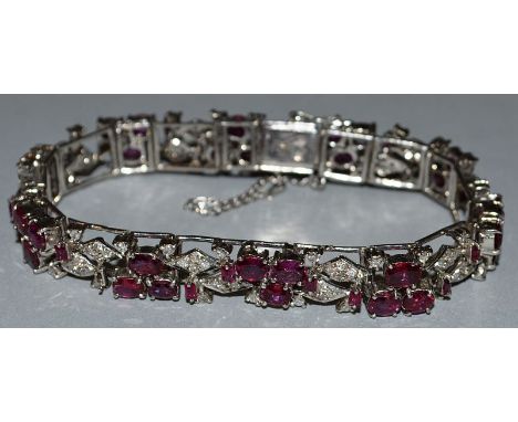 A SUPERB RUBY AND DIAMOND BRACELET set in 18ct white gold.