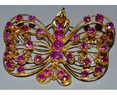 A GOOD RUBY PIERCED BUTTERFLY BROOCH.