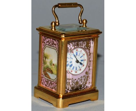 A MINIATURE SEVRES AND BRASS CARRIAGE CLOCK. 2ins high.