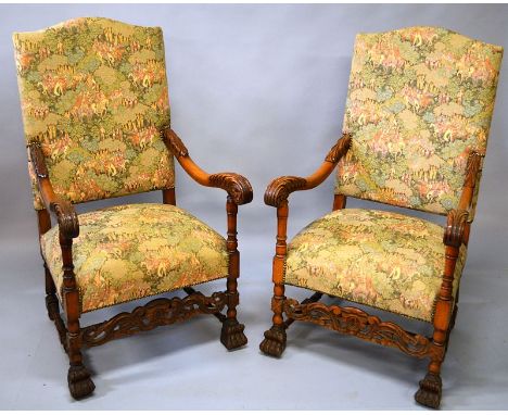 A PAIR OF FRENCH STYLE ARMCHAIRS, with carved beech arms and legs, the backs and seats upholstered with an embroidered fabric