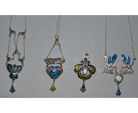 FOUR ART NOUVEAU DESIGN SILVER AND ENAMEL PENDANTS.