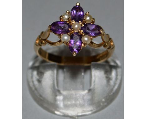 AN AMETHYST AND PEARL RING in gold.