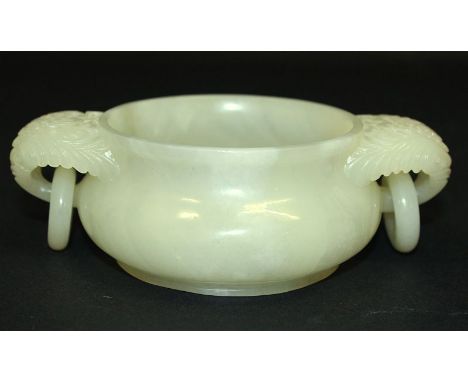 A GOOD QUALITY CHINESE JADE CENSER, with floral carved and loose ring handles, the stone of predominantly pale green tone, 6.