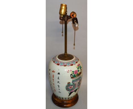 A CHINESE FAMILLE ROSE LAMP painted with flowers, emblem and calligraphy.