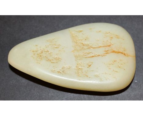 A CHINESE CELADON JADE BOULDER, of rounded arrow form, 3.75in long.