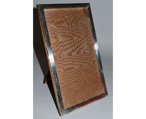 AN ENGINE TURNED UPRIGHT PHOTOGRAPH FRAME. 11ins x 8.5ins.