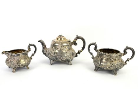 Victorian silver three-piece tea service, elaborately chased and with inscriptions, teapot with ivory insulators, London 1868