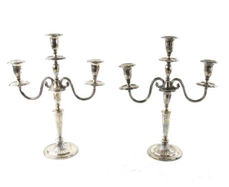 Victorian pair of silver three light candelabra with scroll arms, on reeded columns and round filled bases, by James Dixon &a