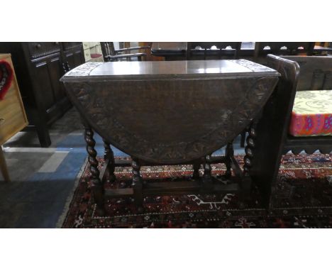 An Edwardian Oak Gate Legged Drop Leaf Barley Twist Dining Table with Carved Border, 91cm Diameter 