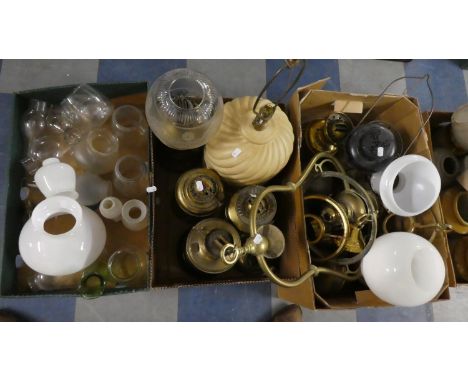 Two Boxes Containing Seven Various Brass Oil Lamps, Glass Shades, Chimneys, Hurricane Lamp etc 