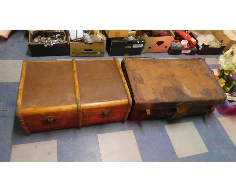 A Vintage Leather Suitcase and a Canvas Covered Travelling Trunk 