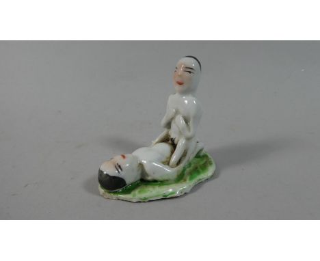 A Chinese Porcelain Erotic Figural Group, 6.5cm High 