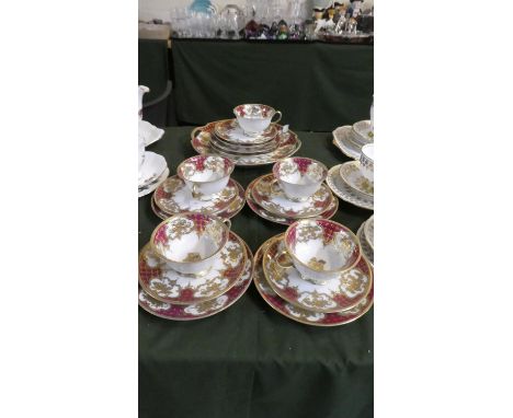 A Part Noritake Red and Gilt Tea Set Comprising Five Trios, Cake Plate, Saucer and Side Plate 