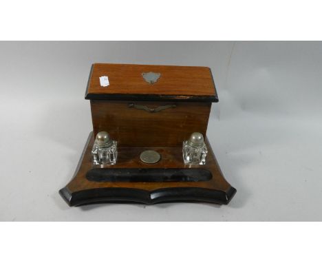 A Late 19th Century Desk Top Ink Stand with Pen Trough and Stationery Rack Having Hinged Lid, 26cm Wide 