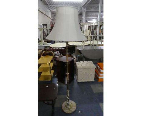 An Onyx and Brass Standard Lamp 