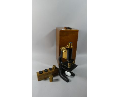 A Cased Brass Mounted American Microscope by Bausch &amp; Lomb, Rochester, New York Complete with 6 Lens 