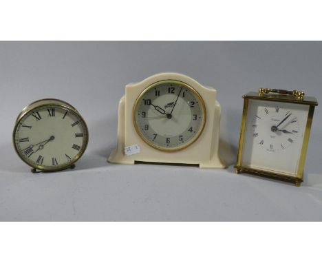 A Smiths White Bakelite Music Alarm Clock, Brass Cased Drum Mantle Clock and a Brass Carriage Clock with Battery Movement 