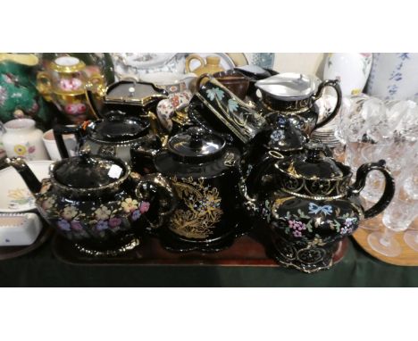 A Tray Containing Various Jackfield Style Teapots and Jugs with Multi Coloured Enamel Decoration 